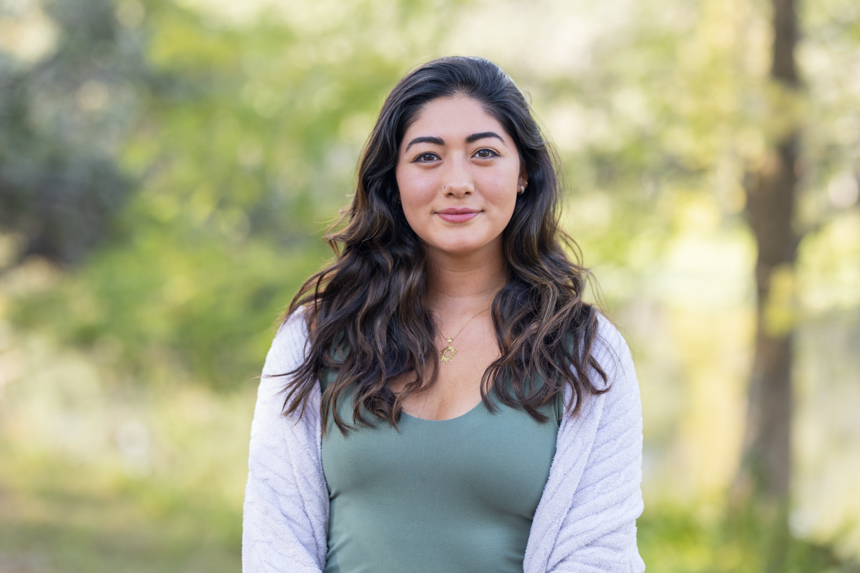 soft smile headshot in nature