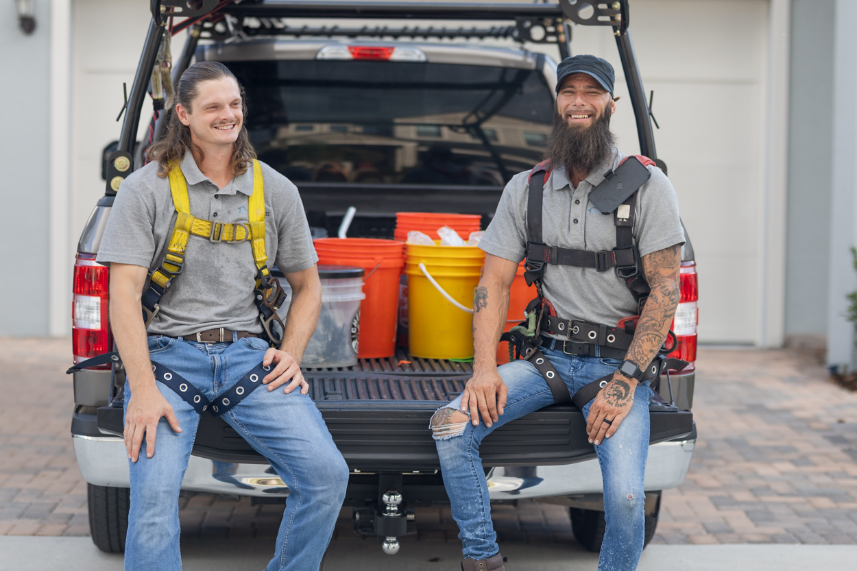 two workers on a truck