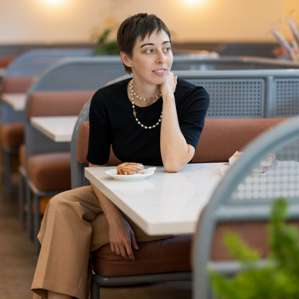 girl sitting in a diner