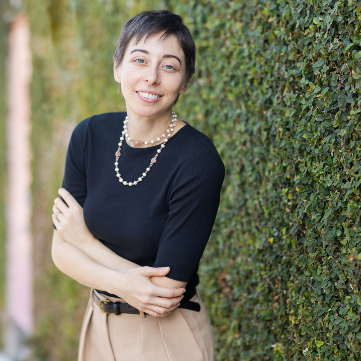 business portrait in front of ivy wall