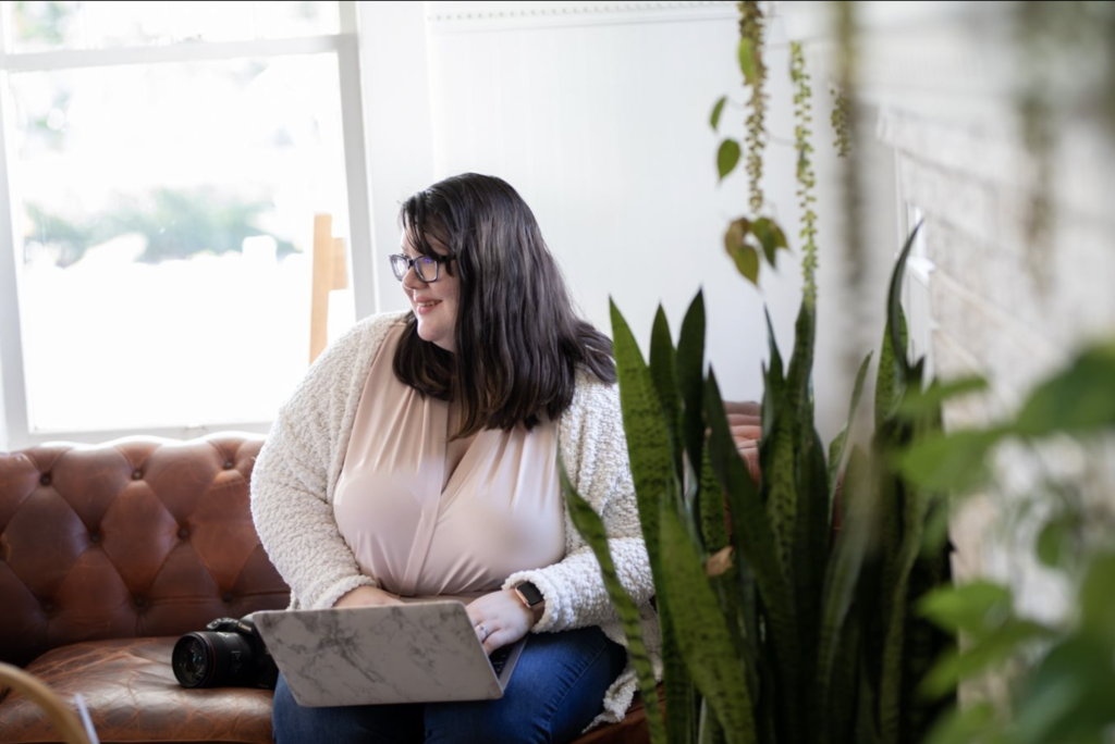woman working on laptop on the couch