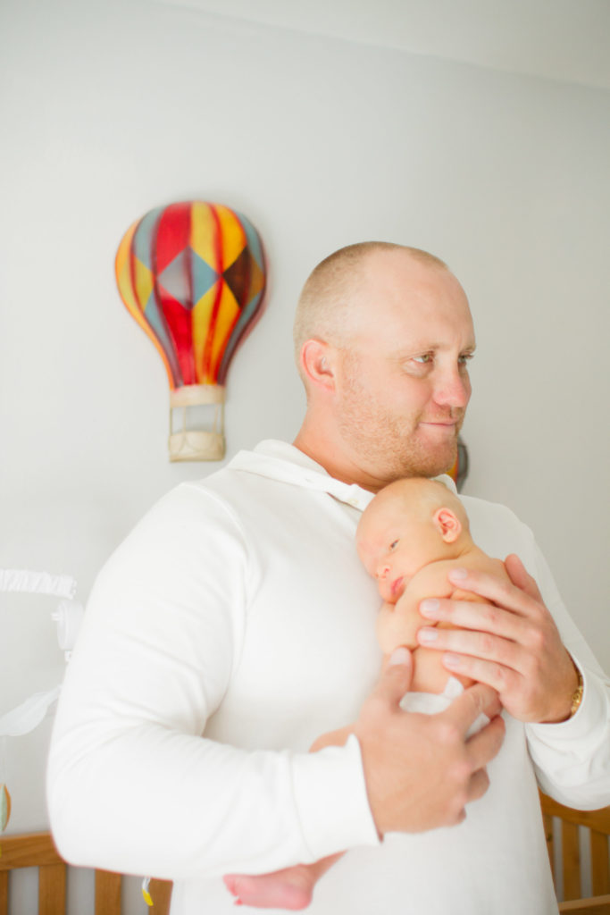dad holding newborn palm harbor