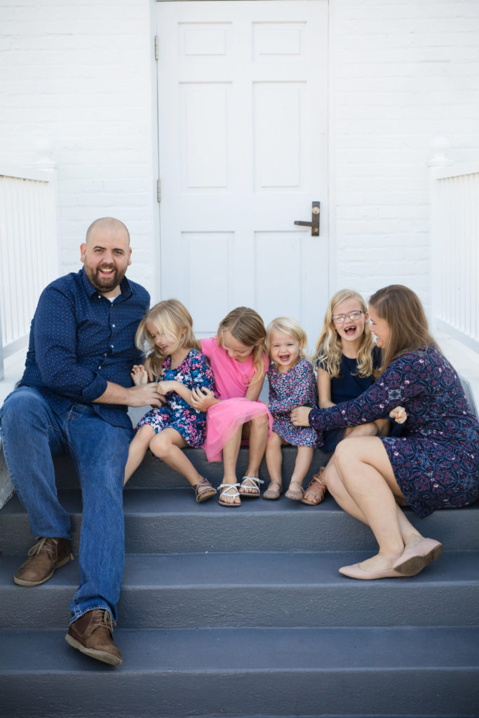 family tickle party on the steps