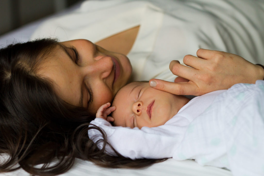 mom laying with newborn