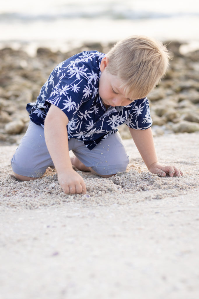 boy playing in the sane
