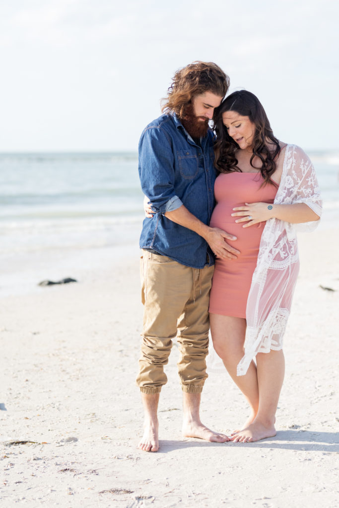 bright beach photos of expecting couple