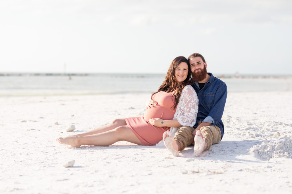 sitting on the beach maternity portrait