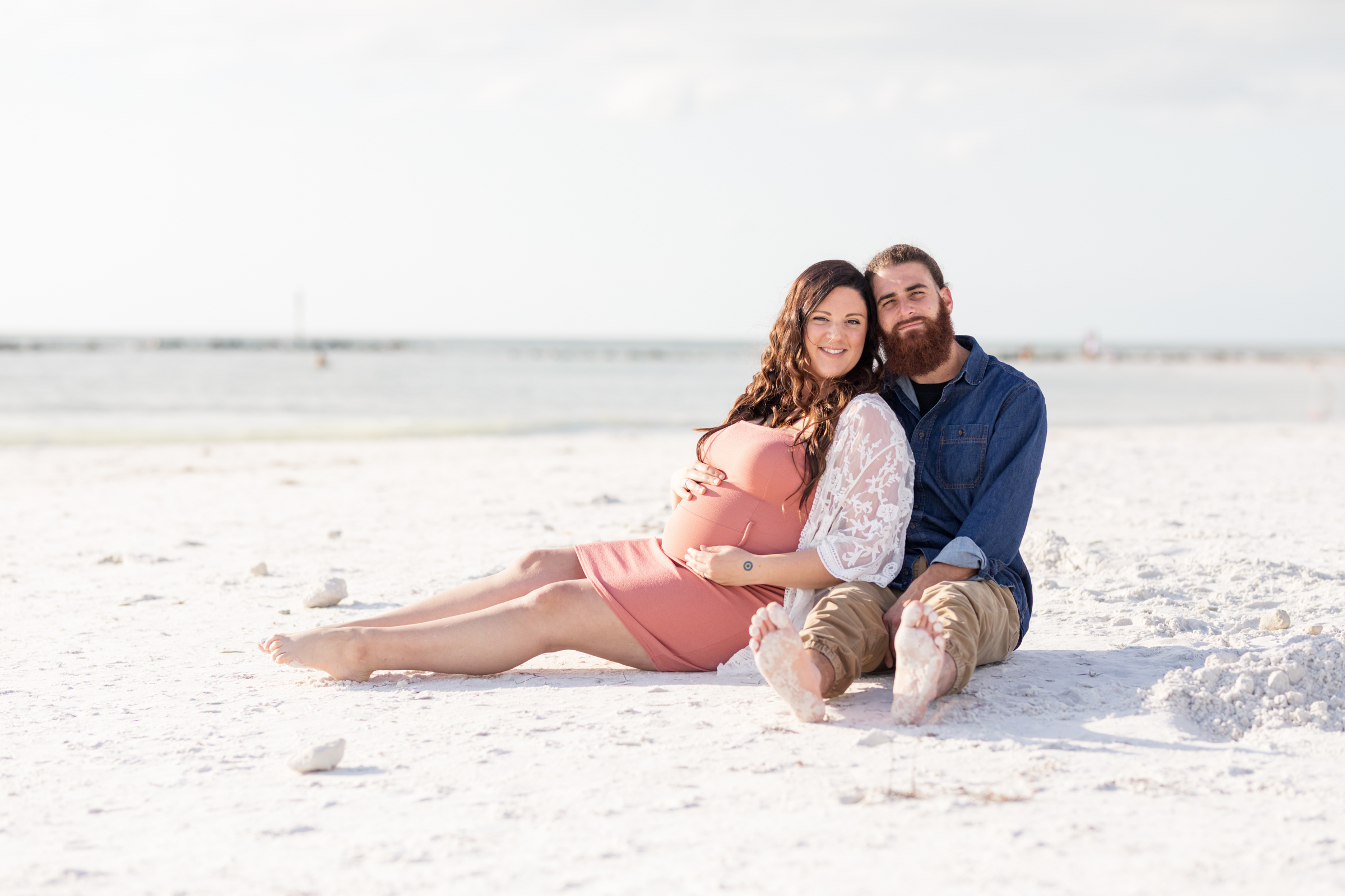 sitting on the beach maternity portrait