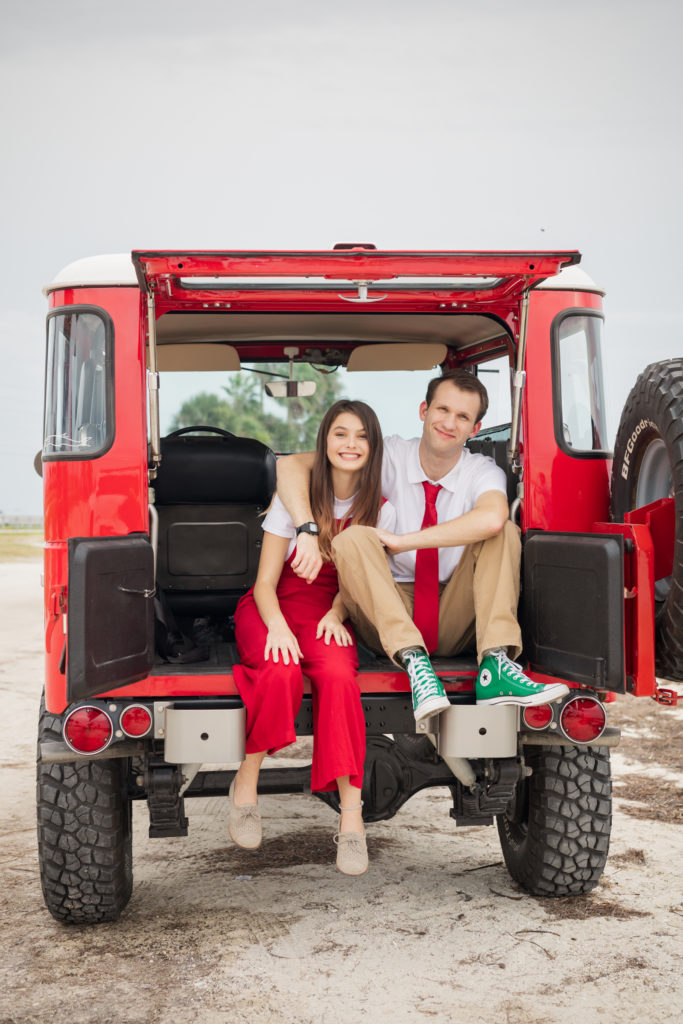 older siblings in the back of a vintage truck