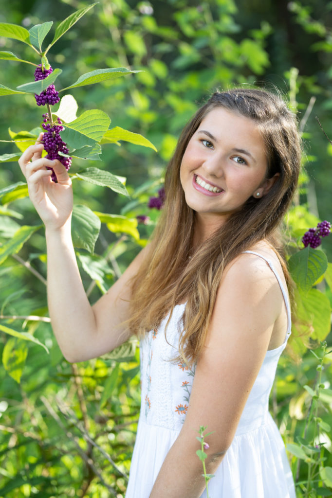 girl posing with berries