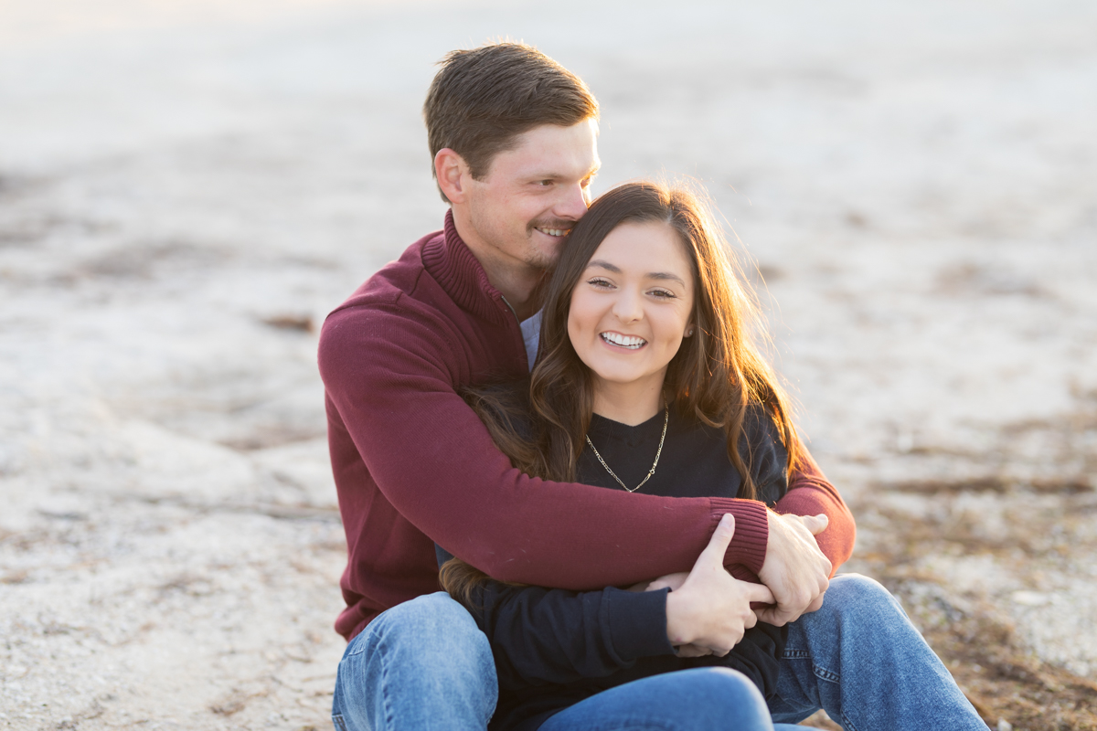 couple sitting together at the beach