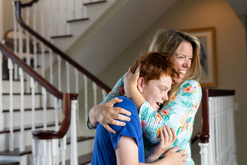 mom hugging son