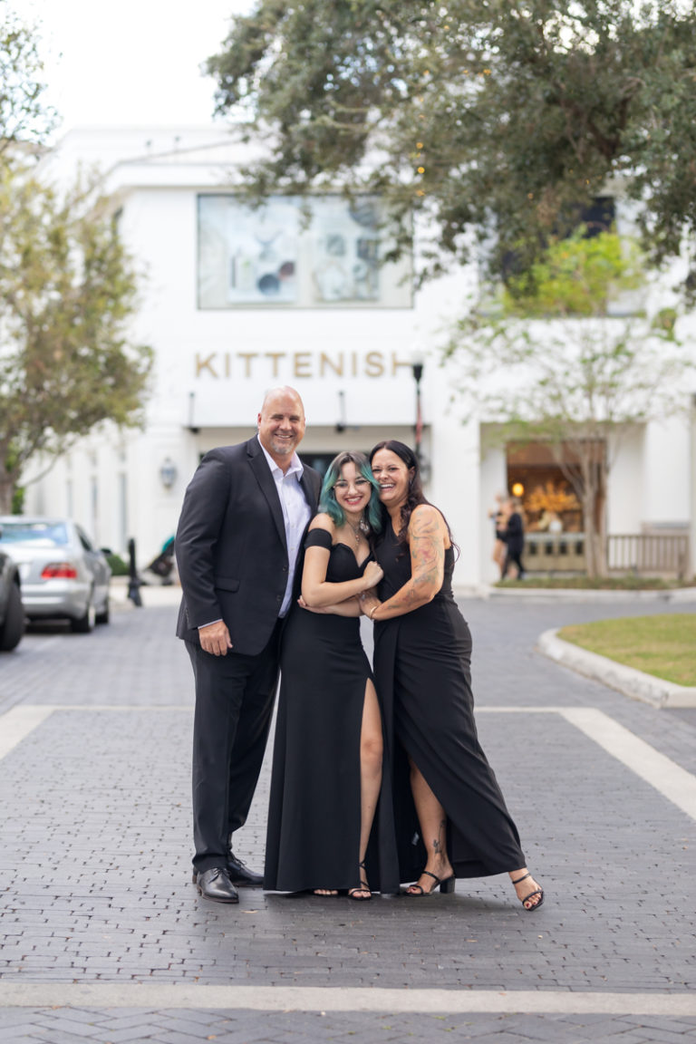 mom and dad with teen dressed up