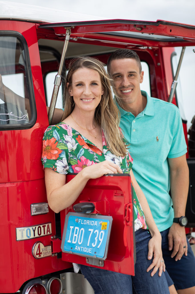 couple hanging out in the back of a vintage jeep