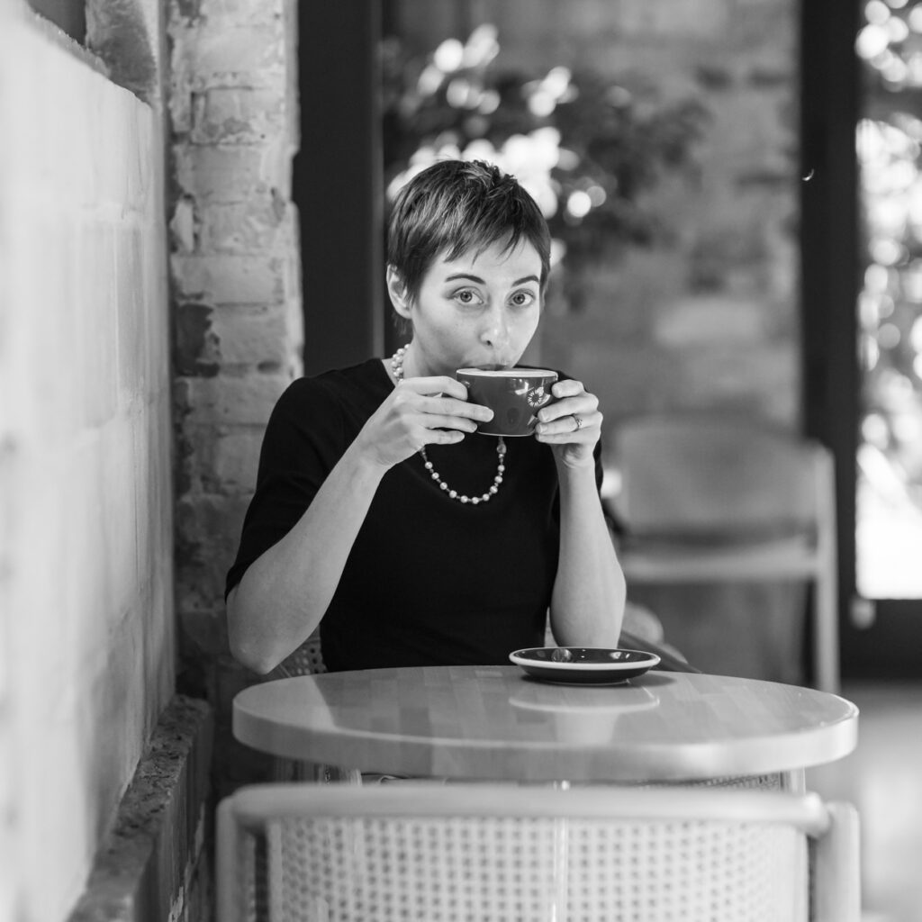 girl drinking from coffee mug