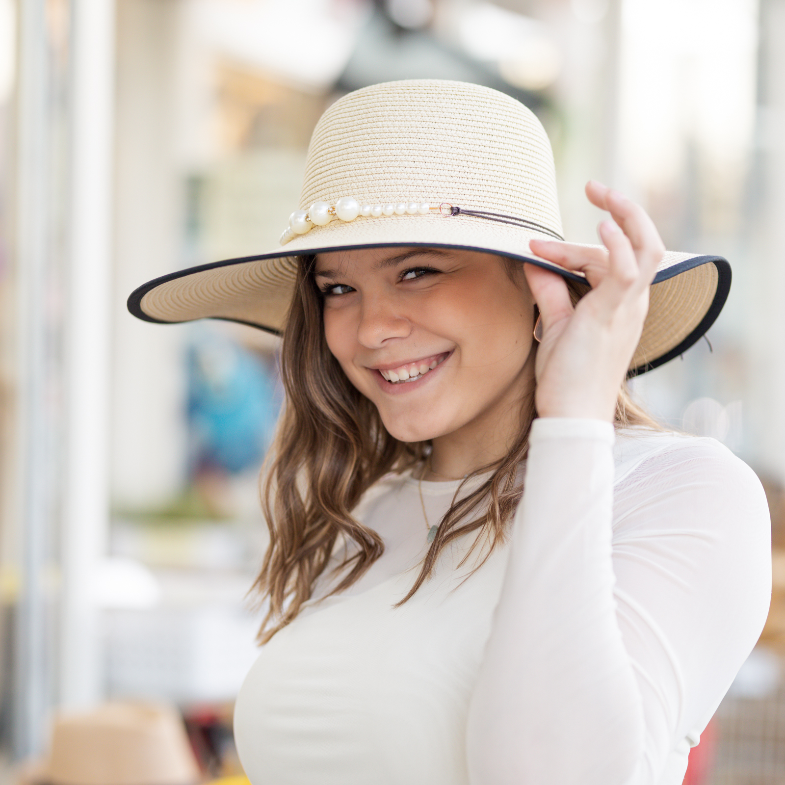 girl in sunhat shopping