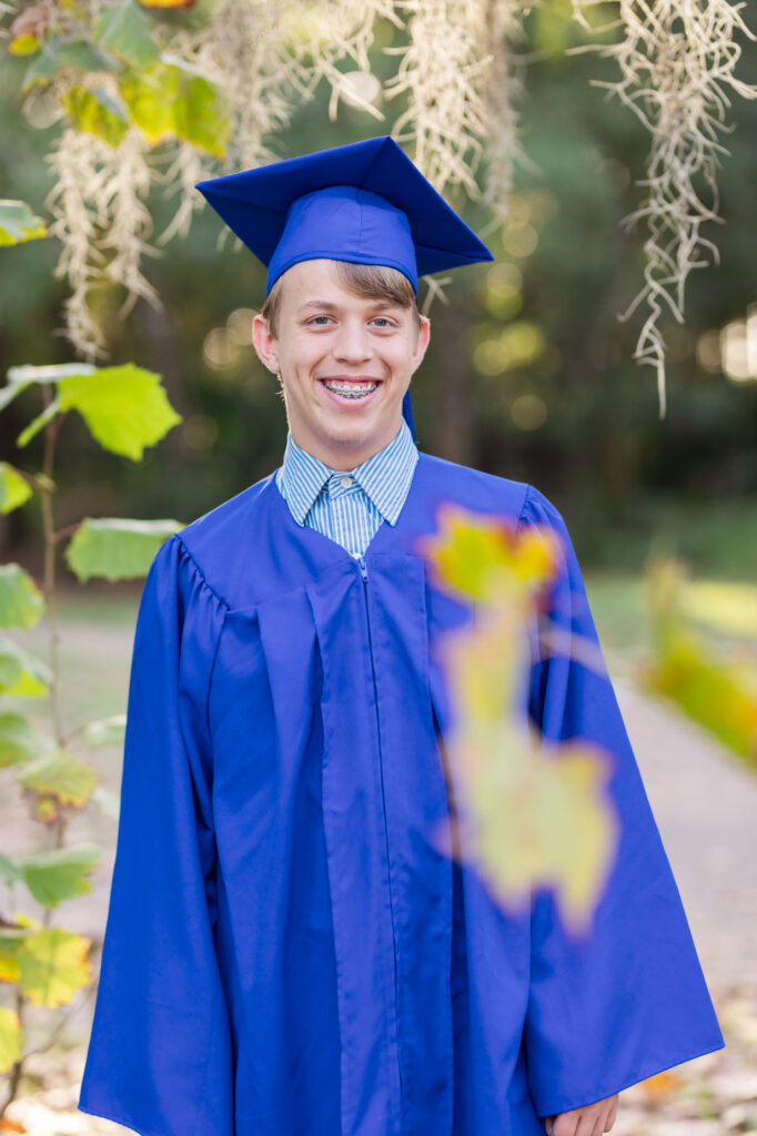 boy in graduation gown and cap