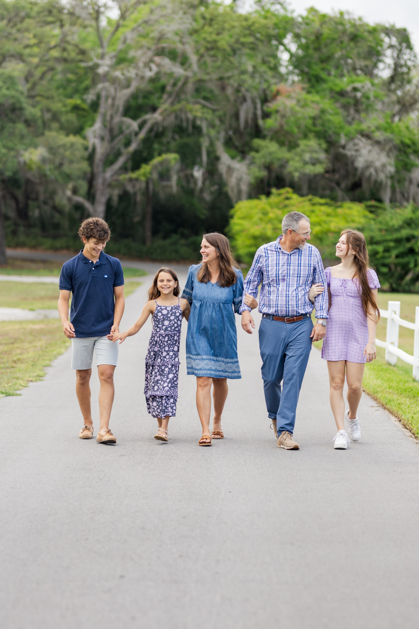 new port richey family photographer family walking down the road