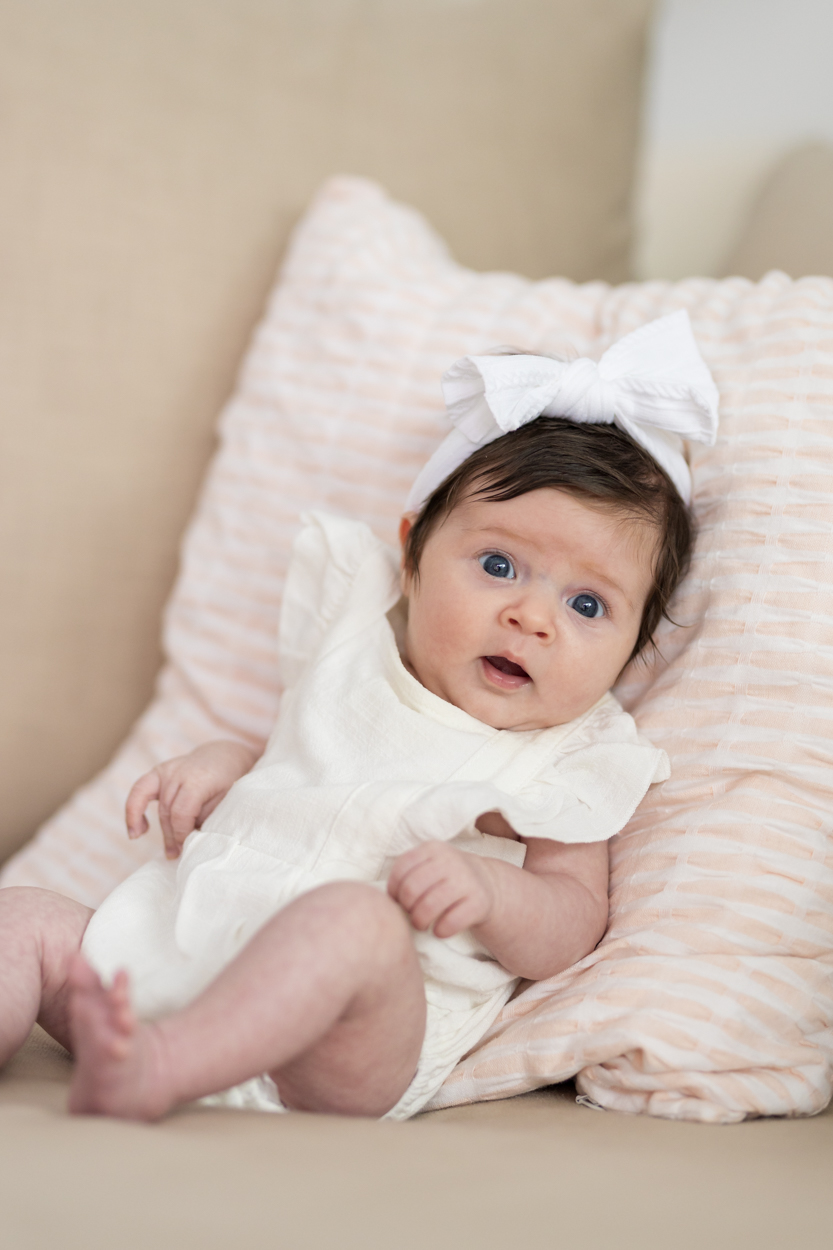 newborn portrait propped up with pillows