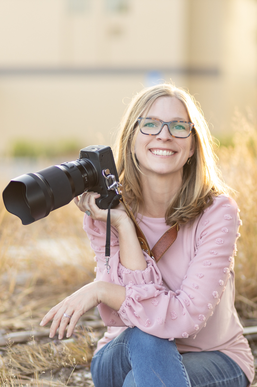 photographer holding up camera