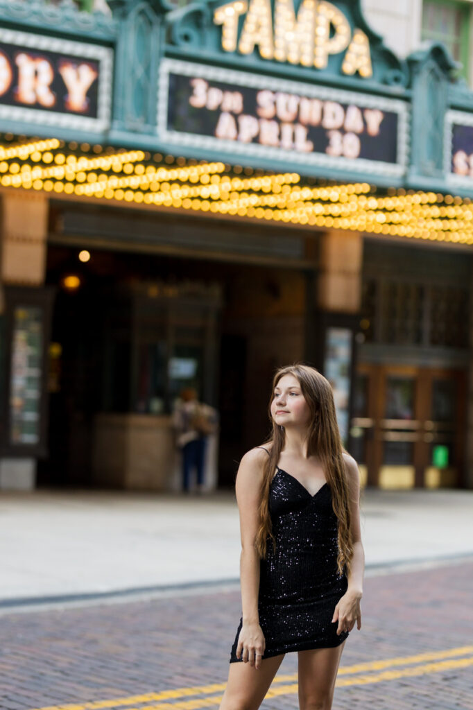 posing in front of tampa theater