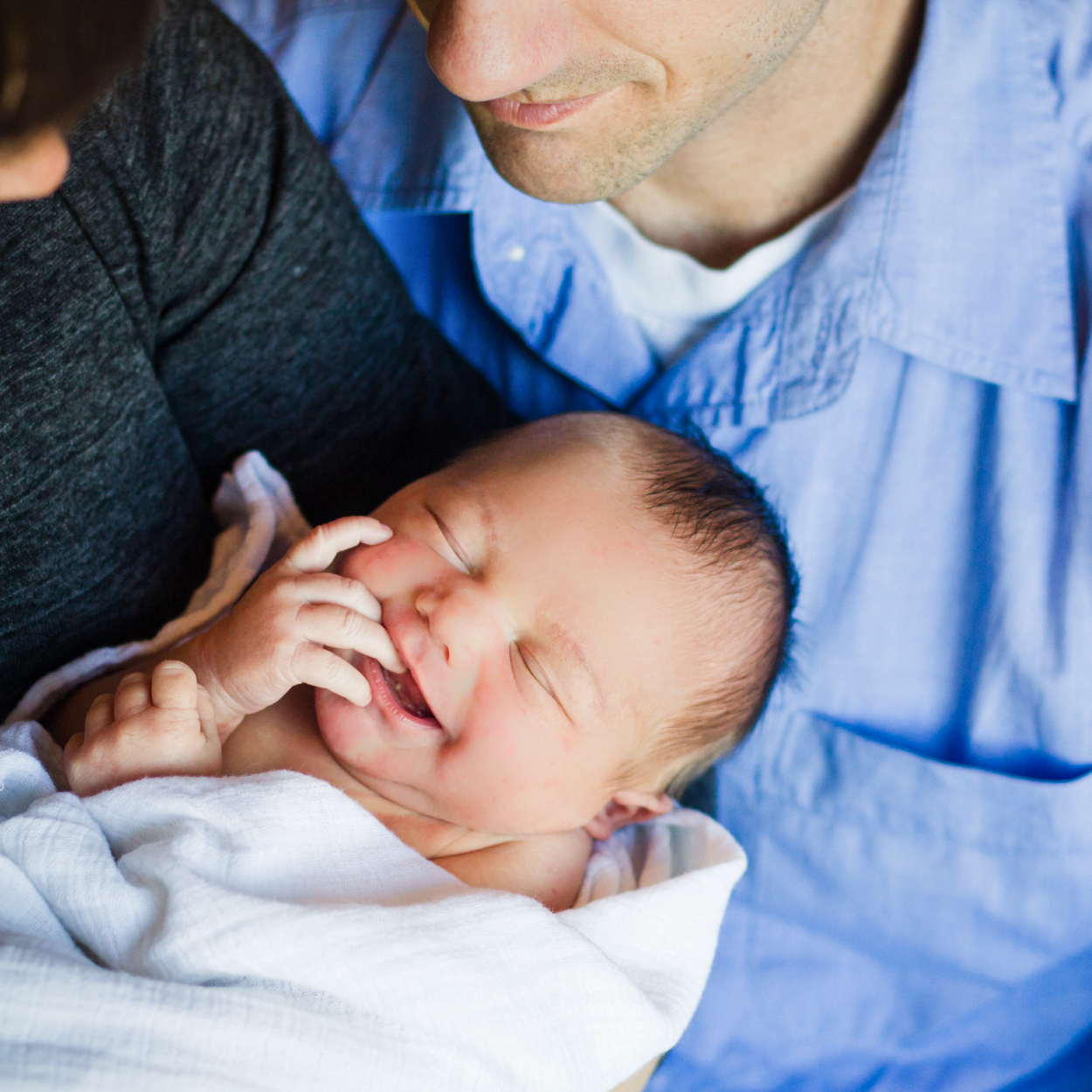 close up of newborn smiling