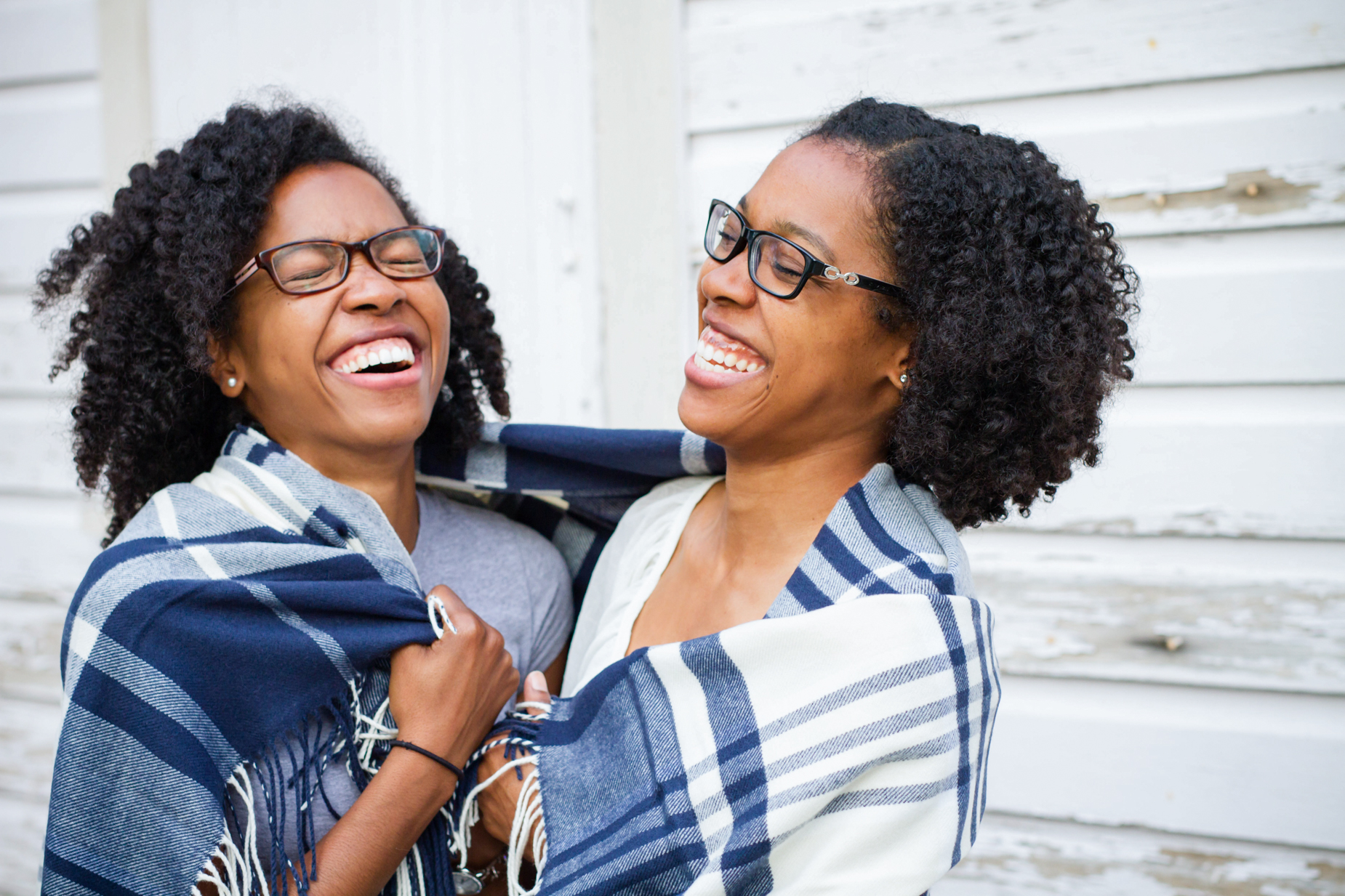 twins sharing a blanket