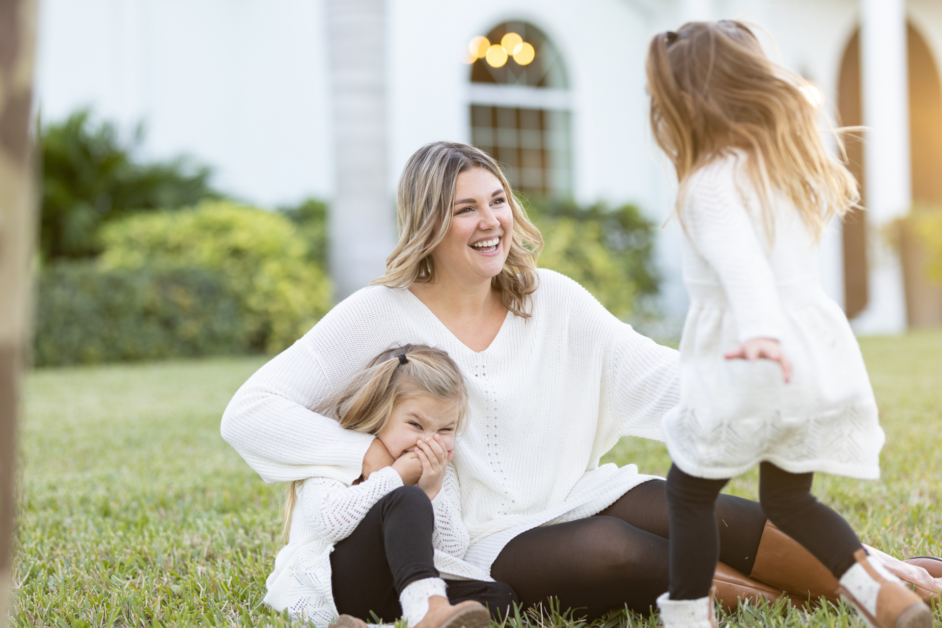 mom laughing with her daughters