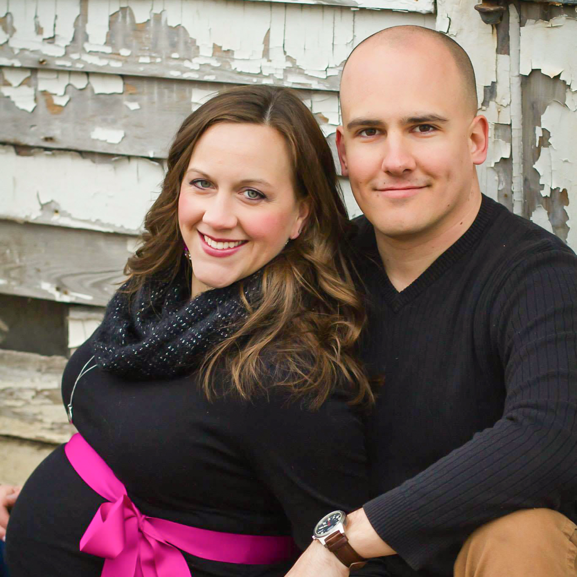 couple posing for maternity photo