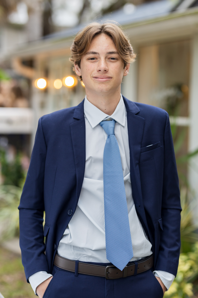 boy in a tie downtown