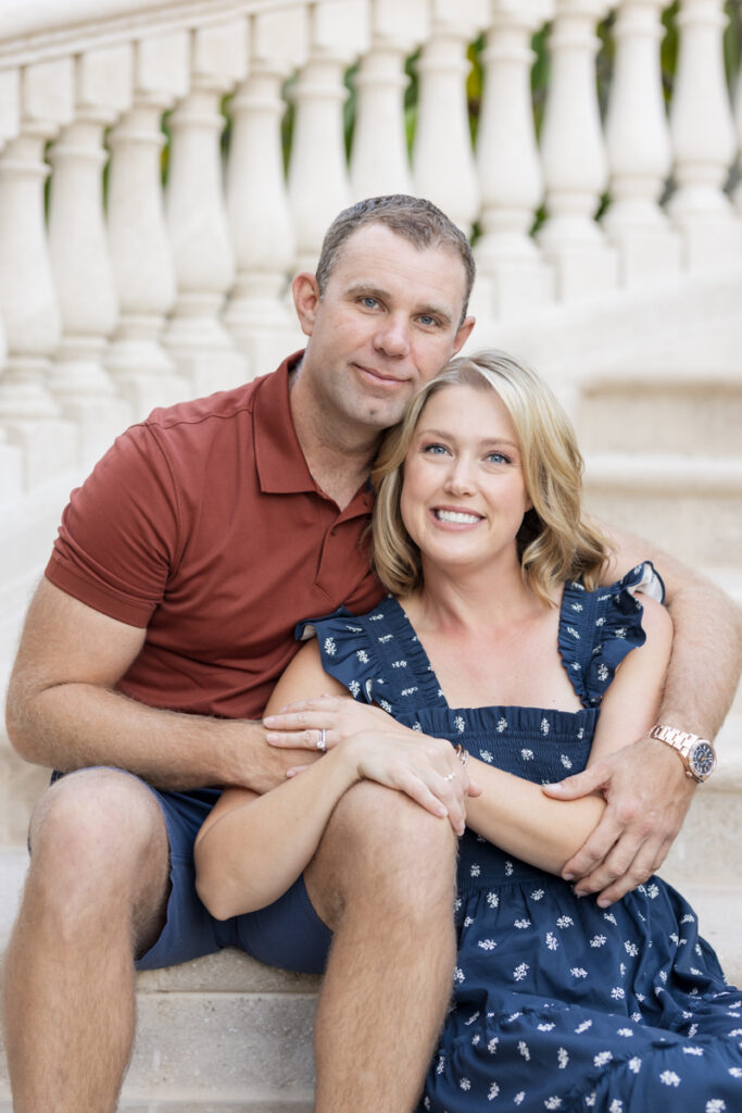 couple smiling together on steps