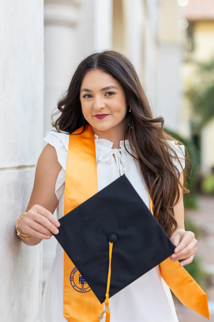 girl posing with her graduation cap