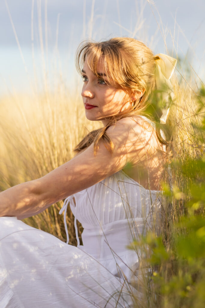 girl sitting in dappled light