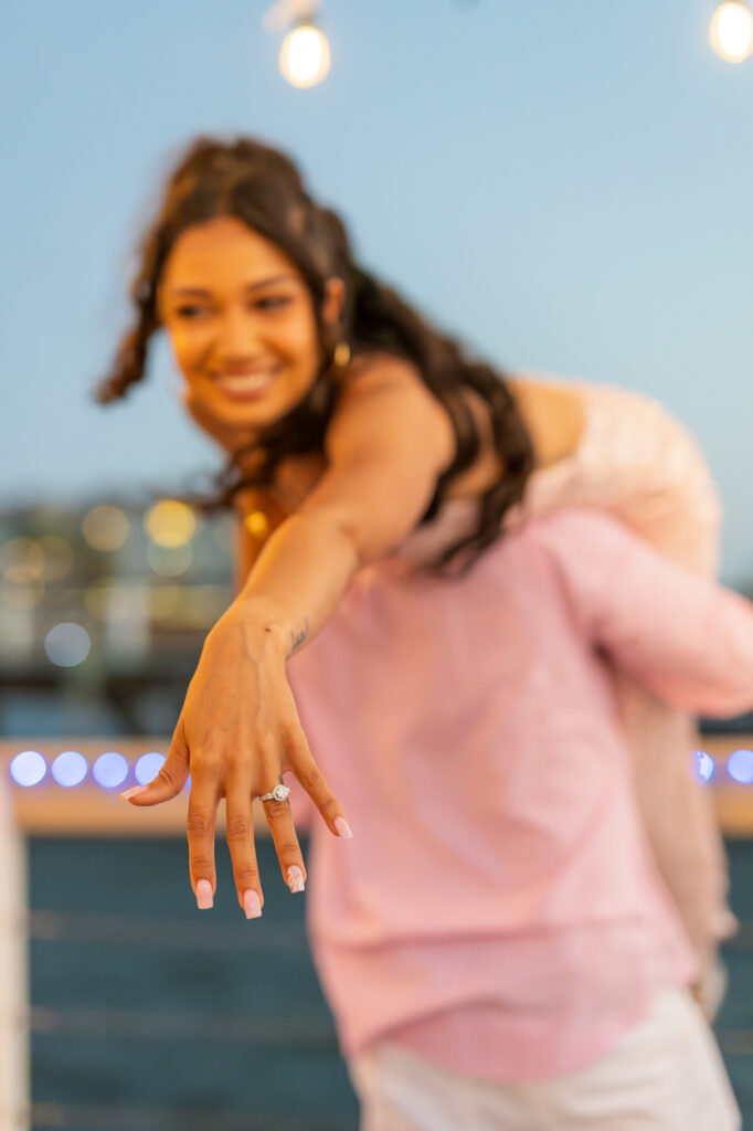 man holding his fiance over his shoulder