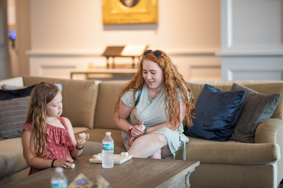 girl and mom playing a boardgame