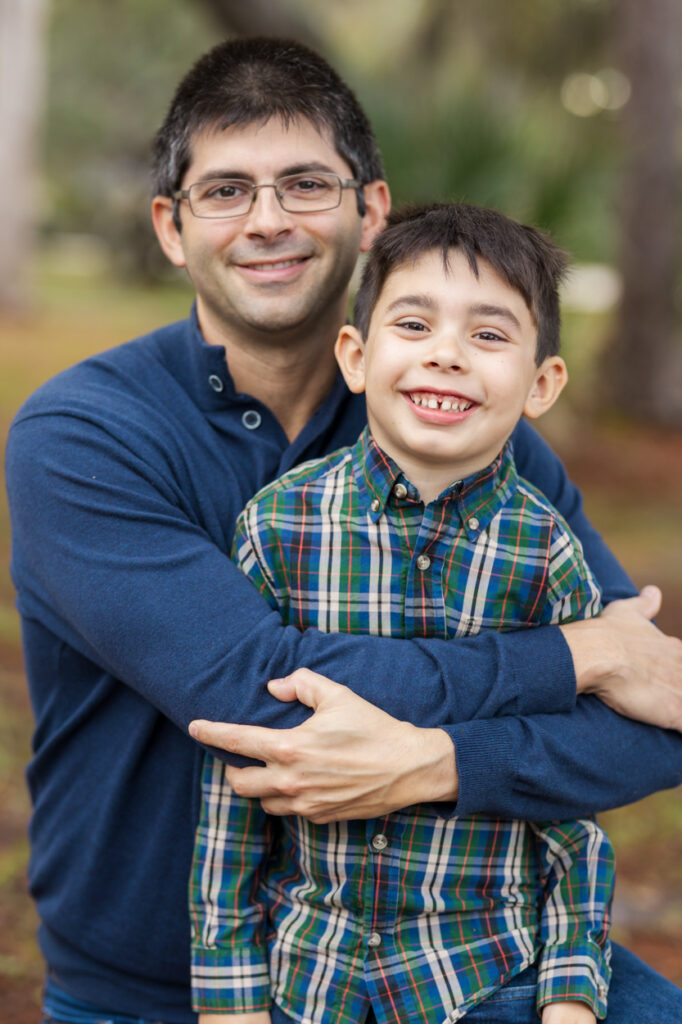 father and son smiling