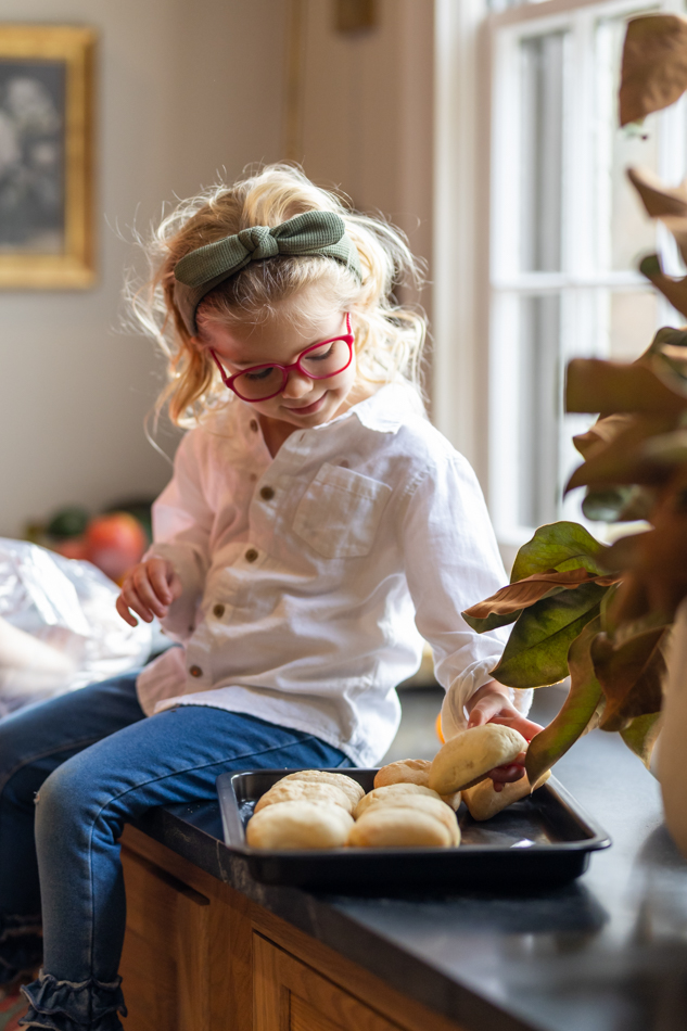 young girl helping cook