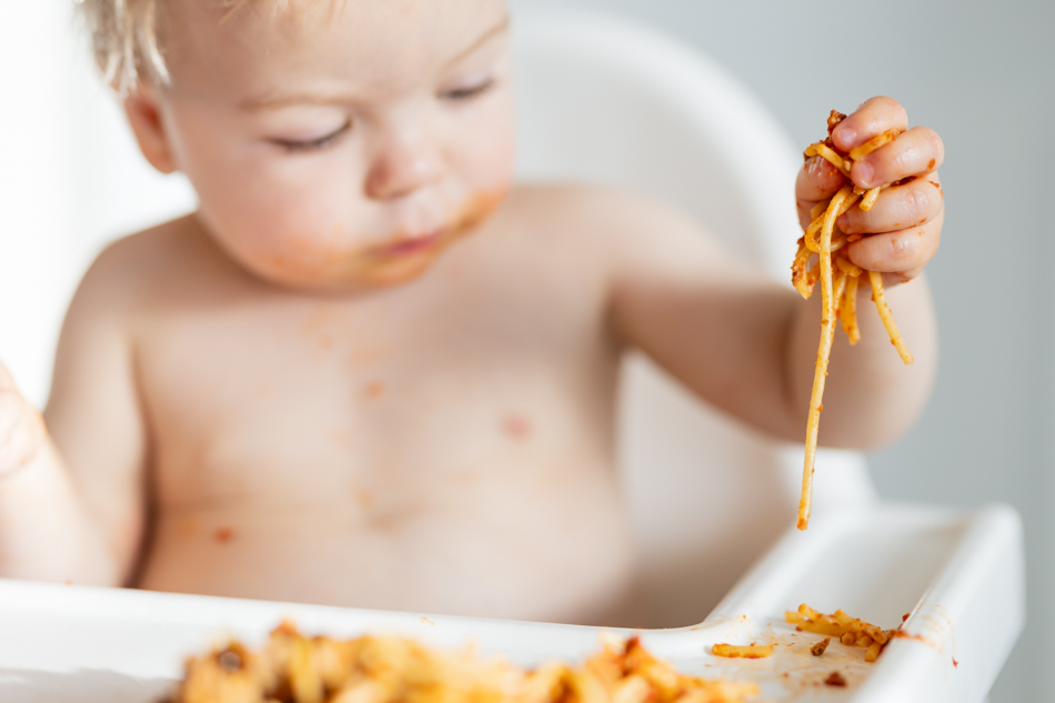 baby eating spaghetti
