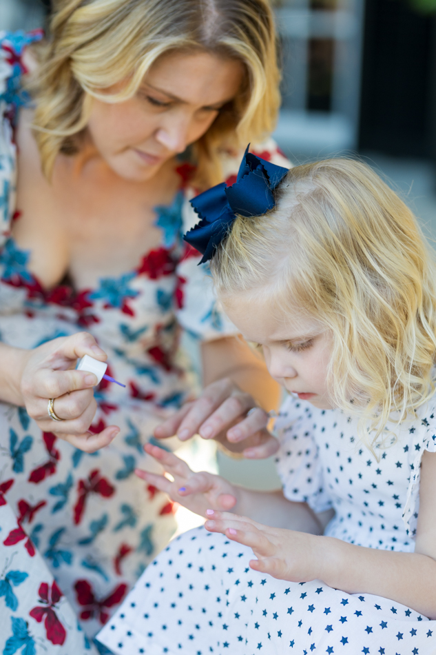mom painting daughter's nails