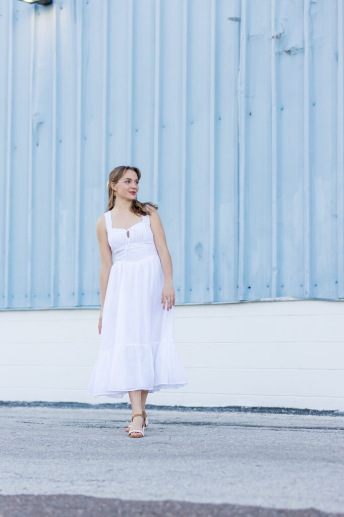 walking with blue wall in background