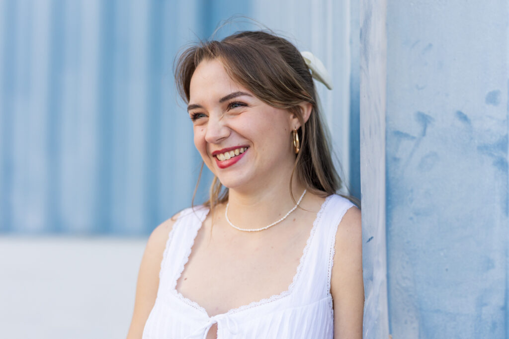 close up of girl smiling, not looking at camera