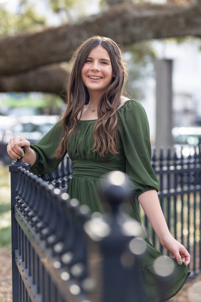 girl posing on the fence