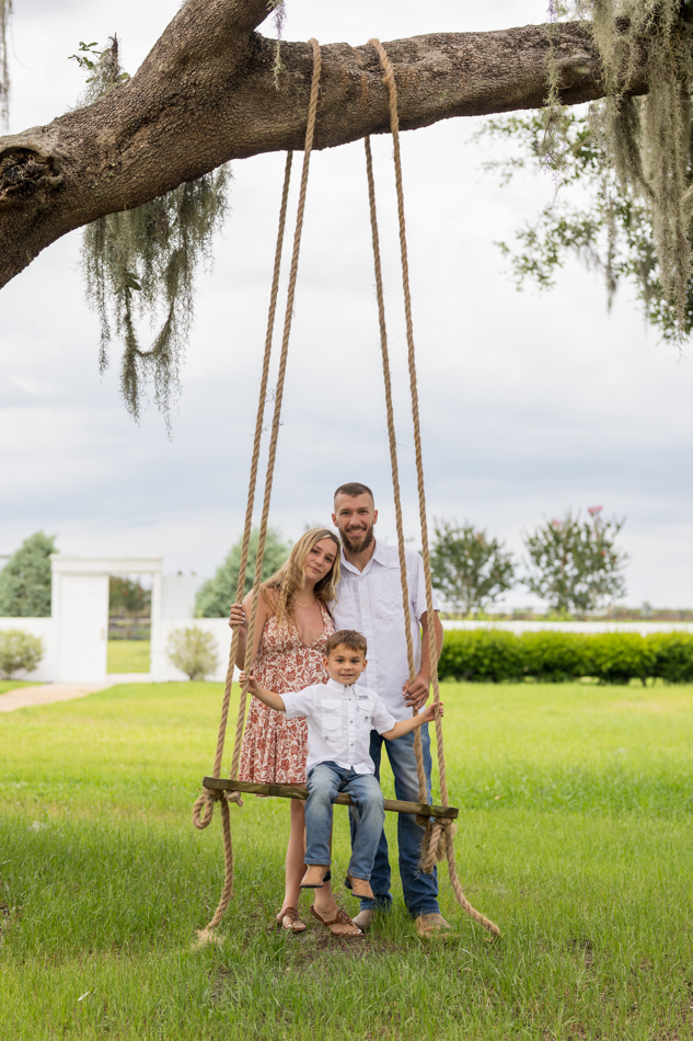 family on tree swing