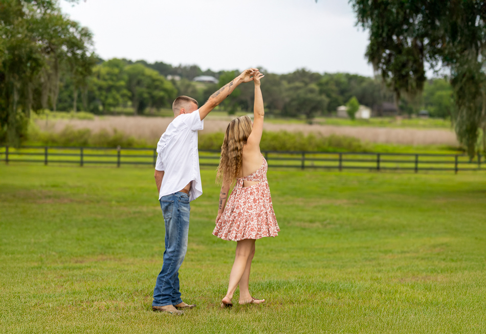 man twirling his fiance