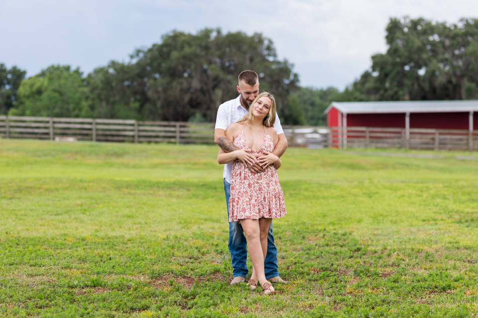 couple posing for pictures on a farm