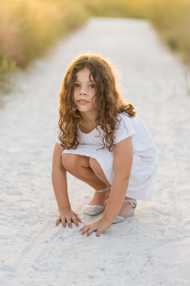 curly hair girl at beach