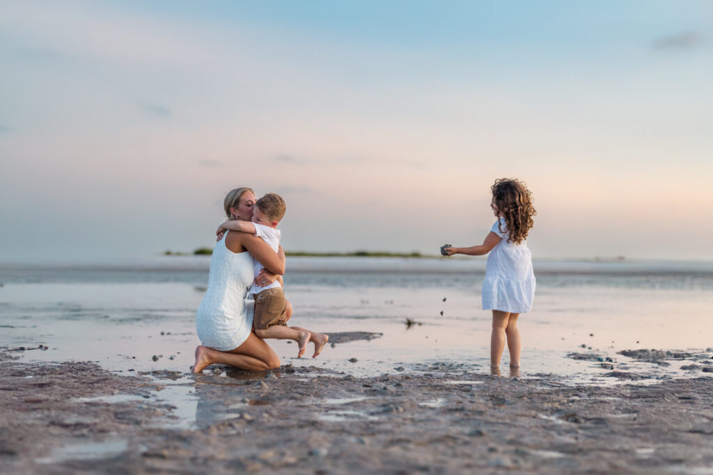 boy ran into mom's arms at the beach