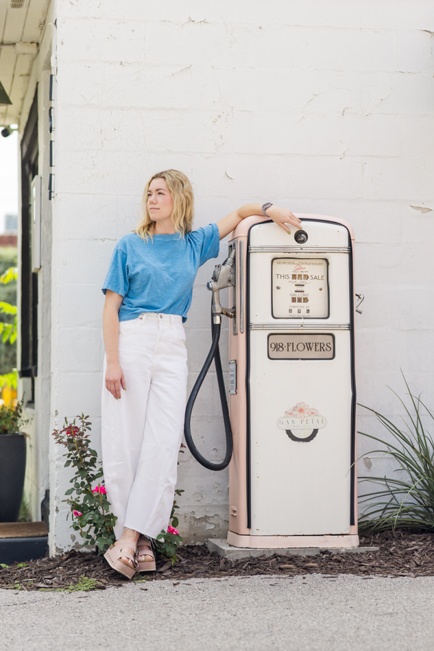 senior picture with a vintage gas pump