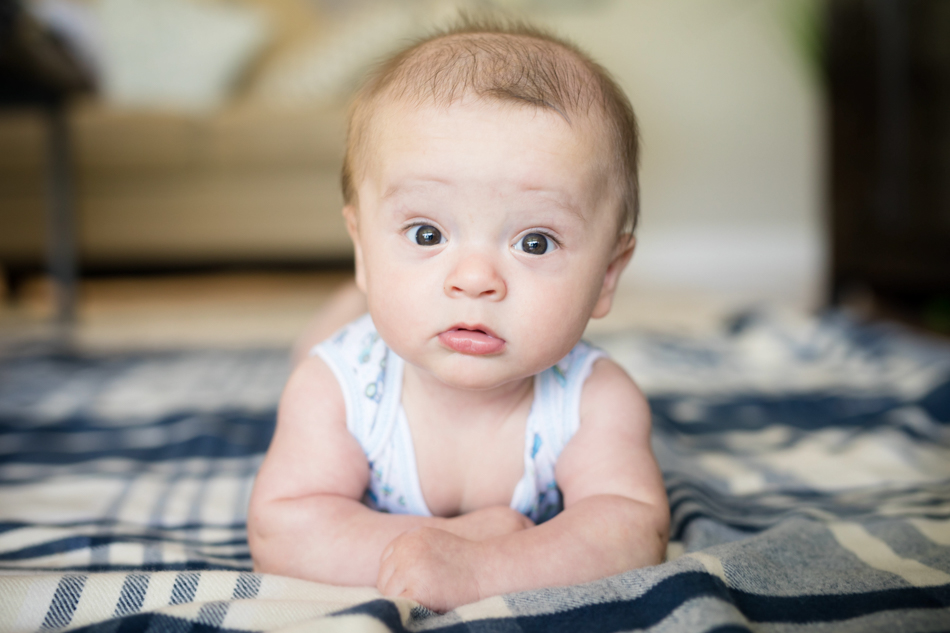 baby laying on a blanket